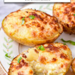 twice baked potatoes on white plate with fork and text overla "twice baked potatoes in the air fryer".