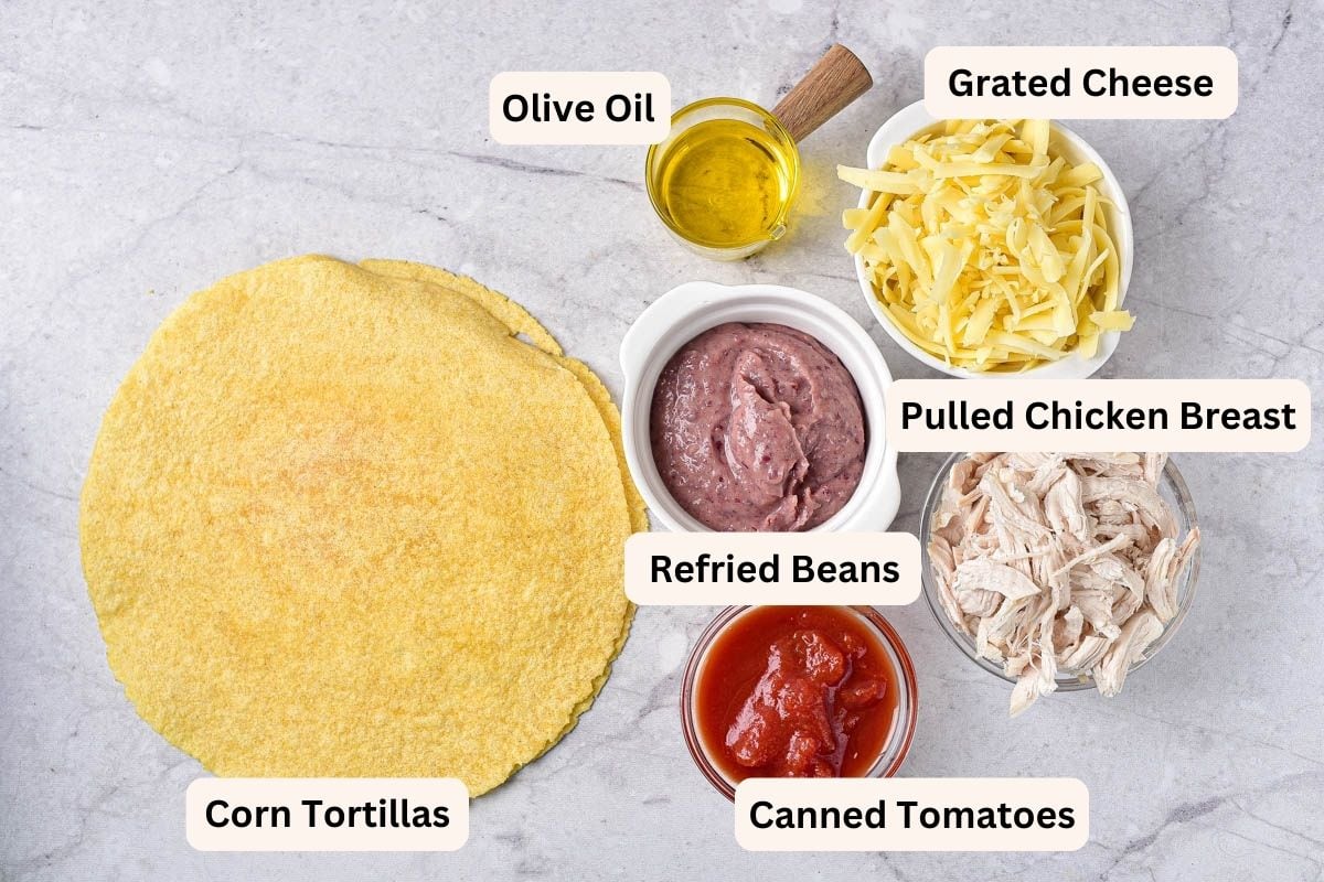 ingredients in bowls with labels on counter for air fryer quesadillas.