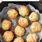 cooked chicken meatballs in air fryer with text overlay "chicken meatballs in the air fryer".