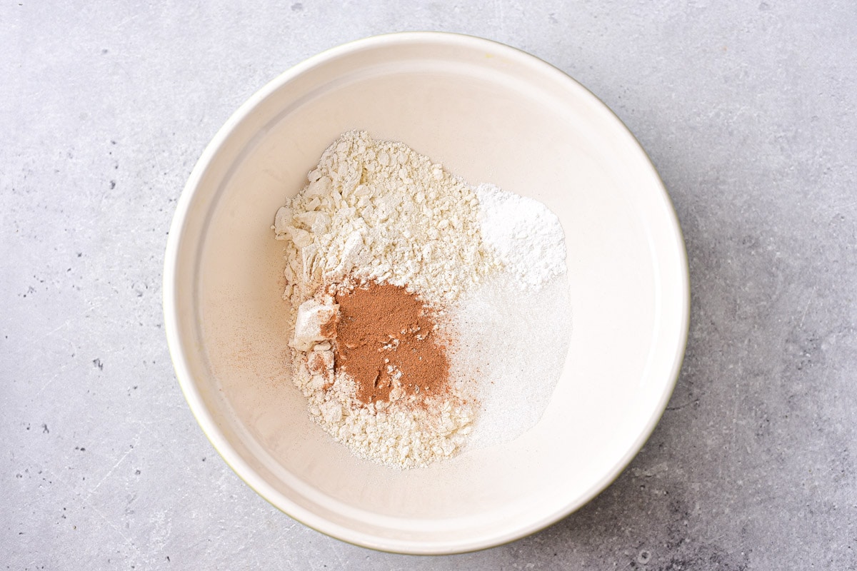 dry ingredients in white mixing bowl on counter.