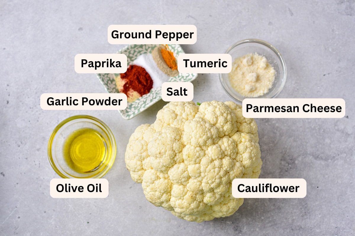 ingredients for cauliflower steaks in bowls on counter with labels.