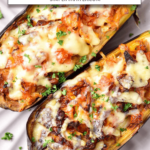 cooked stuffed eggplant on white plate with text overlay 