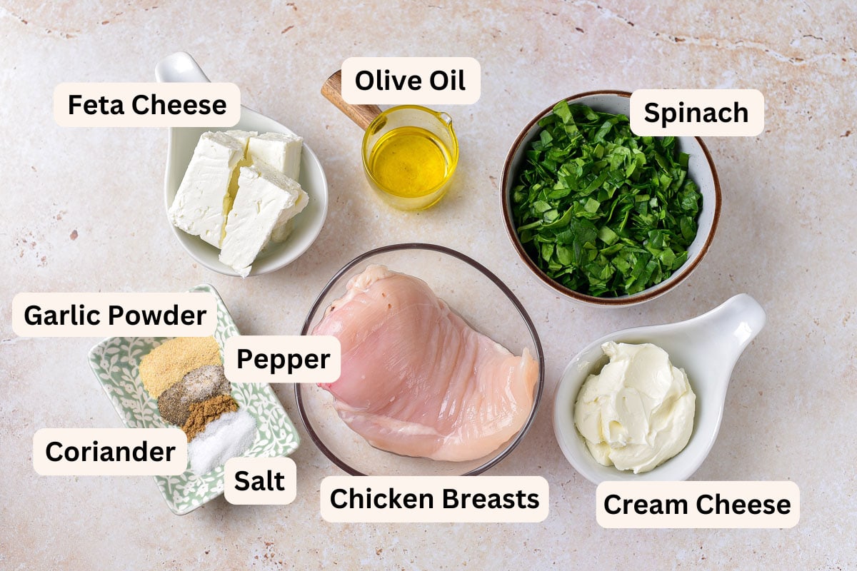 ingredients to make air fryer stuffed chicken breasts in bowls on counter.