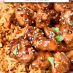 cooked chicken pieces with marinade and rice on pink plate with text overlay "honey garlic chicken in the air fryer".