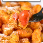 crispy gnocchi on plate, one on fork with dipping sauce, and text overlay "crispy gnocchi in the air fryer".