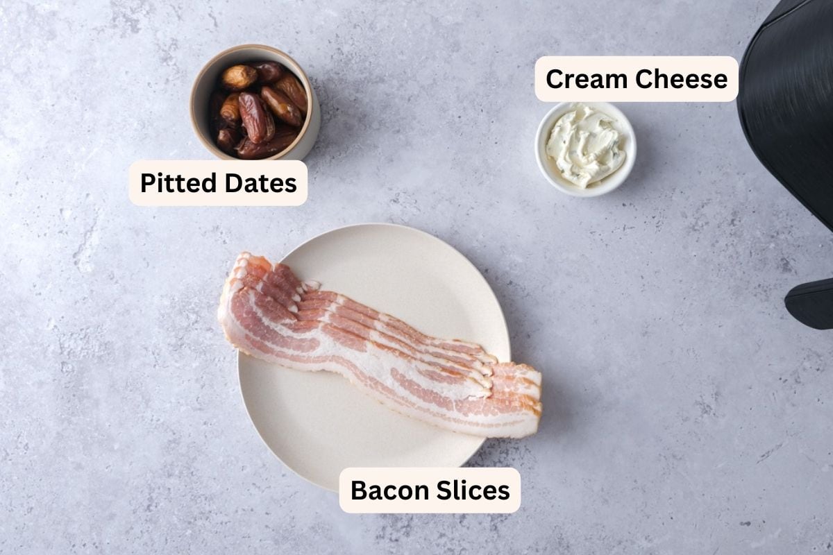 ingredients to make bacon wrapped dates on plates on counter with labels.