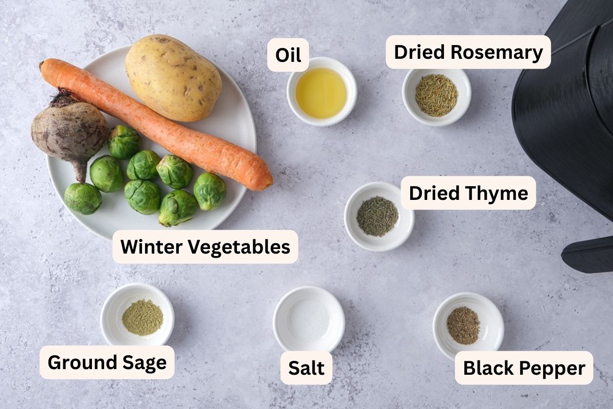 ingredients to make roasted winter vegetables on counter in bowls with labels.