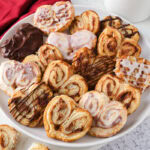 air fryer puff pastry hearts on plate on counter.