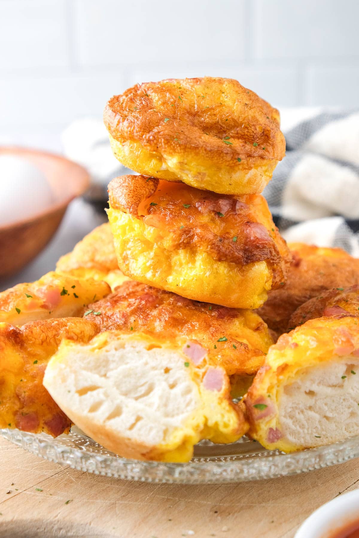 stack of egg bites on plate with cloth behind.