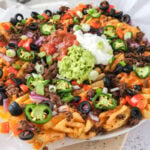 loaded irish nachos on parchment peaper