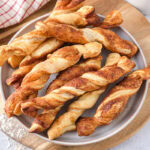 puff pastry twists on plate with counter top around.