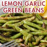 cooked green beans in bowl with lemon wedges and text overlay "easy side dish air fryer lemon garlic green beans".