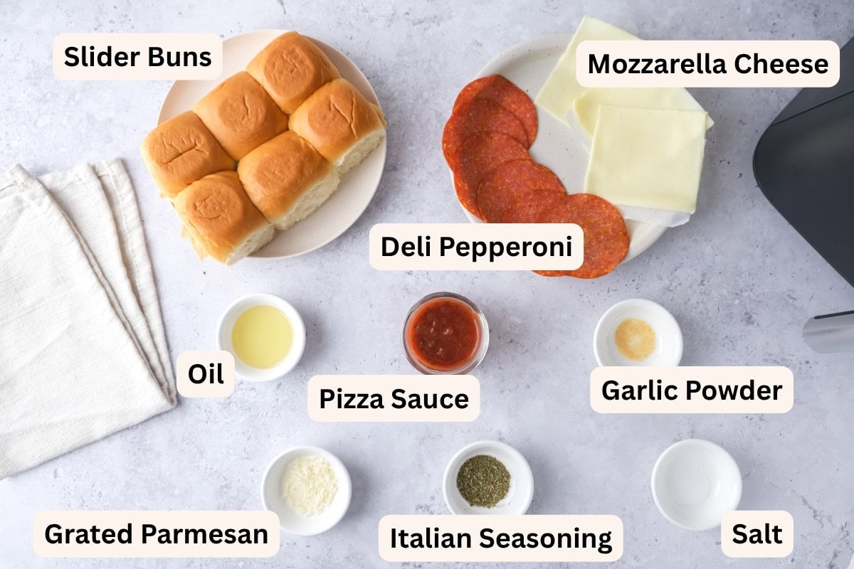 ingredients to make pizza sliders on counter with labels.