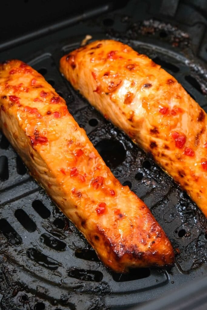 sweet chili fillets in air fryer basket.