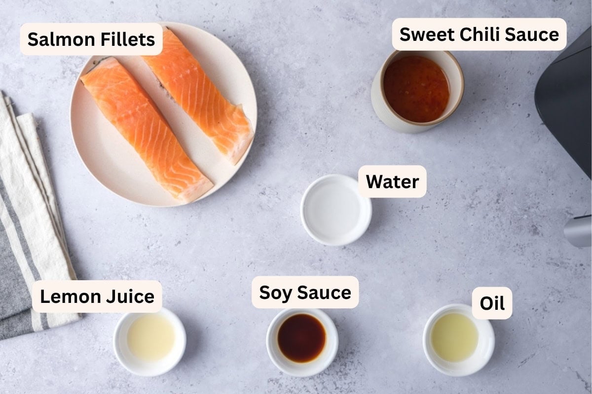 ingredients to make sweet chili salmon on counter in ramekins with labels.
